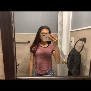 Striped pink and black shirt.